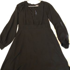Black low cut, long sleeve mini dress